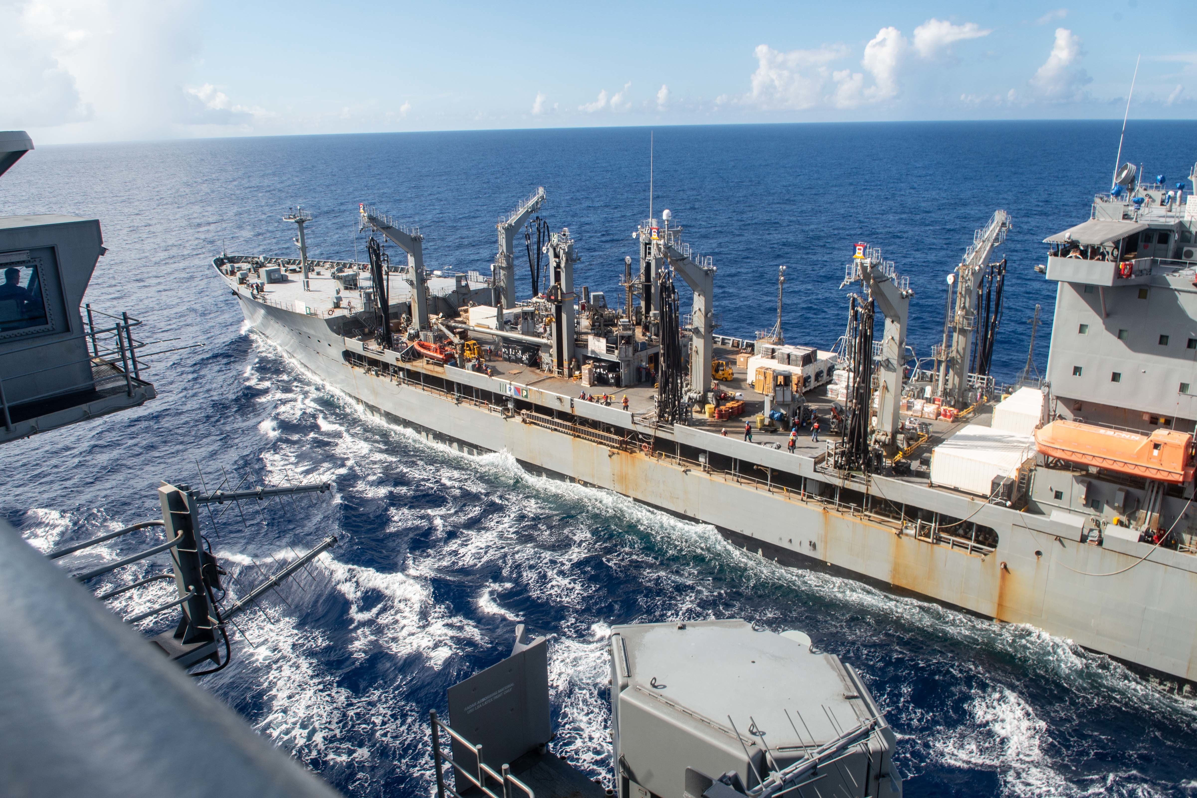 The Navy's only forward-deployed aircraft carrier USS Ronald Reagan (CVN 76) steams alongside fleet replenishment oiler USNS John Ericsson (T-AO 194) for a replenishment-at-sea.