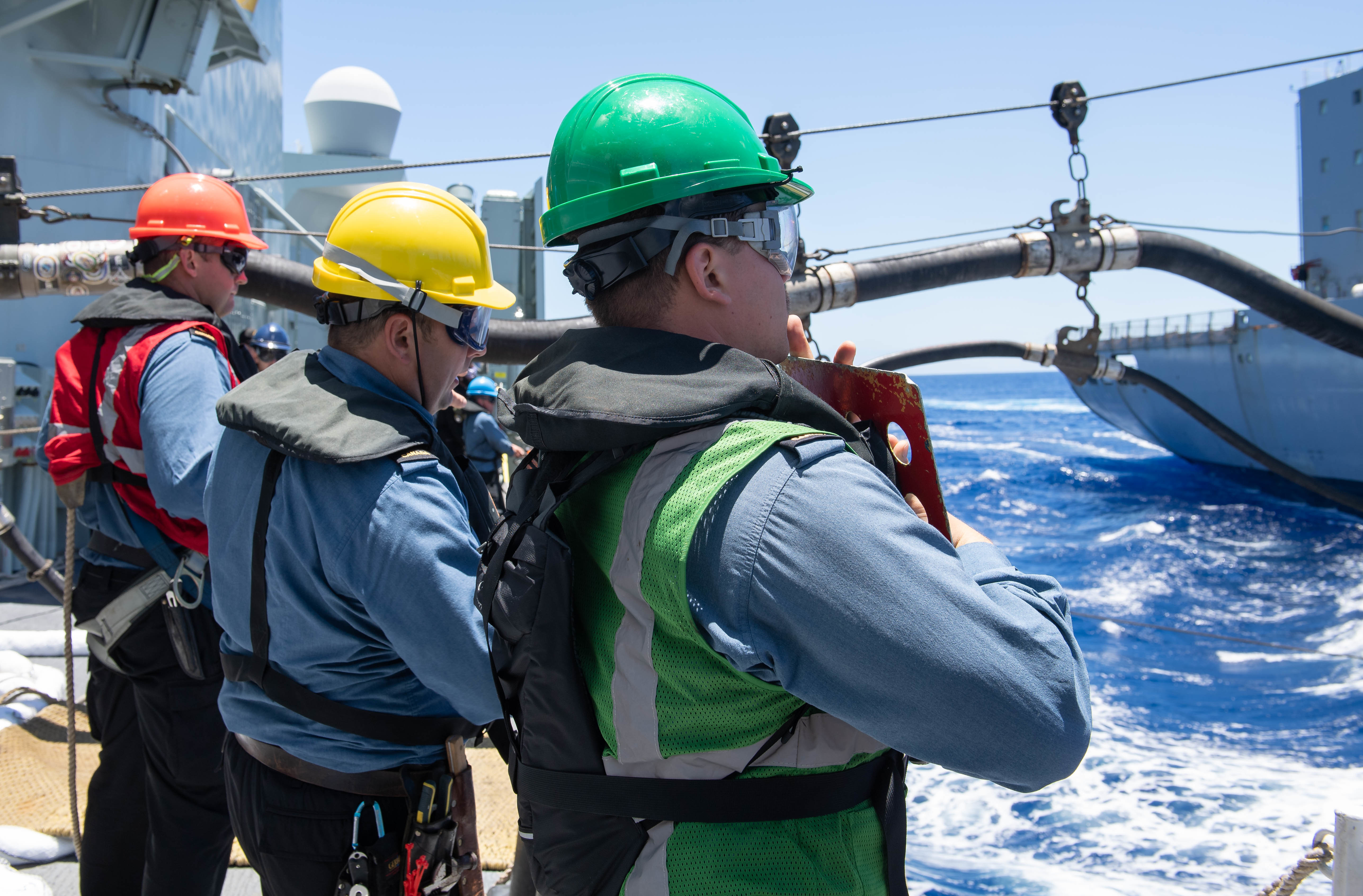 Royal Canadian Navy Ordinary Seaman Kilian Soch participates in a replenishment-at-sea with USNS Henry J. Kaiser (T-AO 187) during Exercise Rim of the Pacific (RIMPAC) 2020.