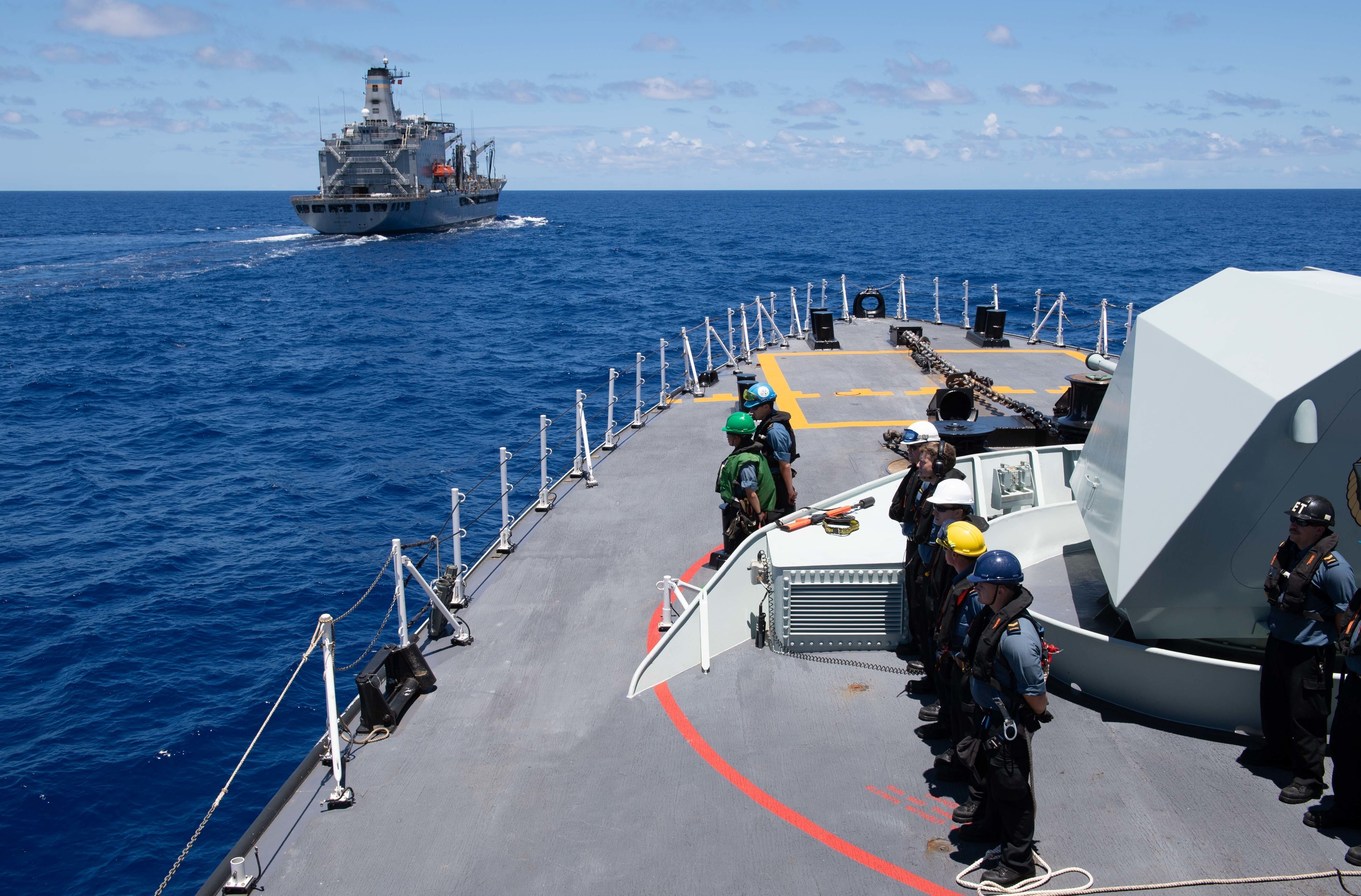 Sailors aboard the Royal Canadian Navy frigate HMCS Winnipeg (FFH 338) participate in a replenishment-at-sea with the Military Sealift Command fleet replenishment oiler USNS Henry J. Kaiser (T-AO 187)