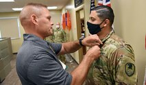 Col. Stephen Parrish, commander, U.S. Army Satellite Operations Brigade, awards Sgt. David Rosales, Headquarters and Headquarters Company, 53rd Signal Battalion, the Army Commendation Medal Aug. 7, for his heroic efforts in assisting medical personnel at the scene of a traffic accident in Colorado Springs, Colorado, July 23. (U.S. Army photo by Staff Sgt. Aaron Rognstad/RELEASED)