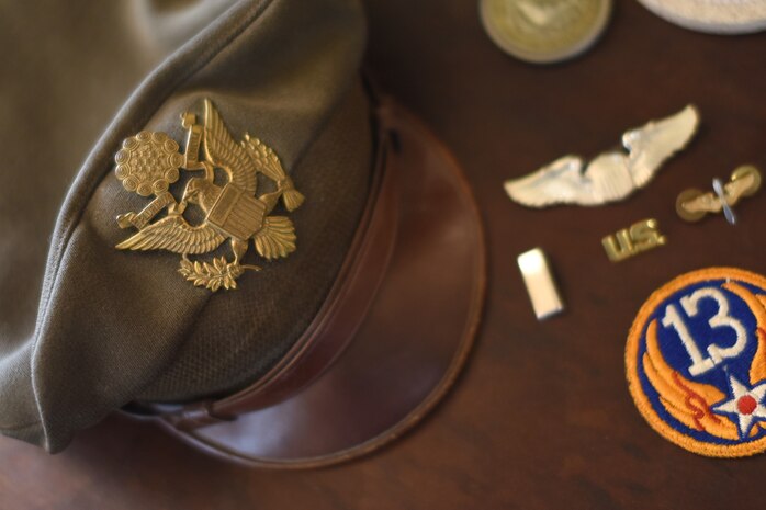 Retired World War II veteran John Fisher Lammey’s objects are displayed on table at his home in Savannah, Ga.,  July 24, 2020. The objects were displayed to remind Lammey of his time spend in the service.