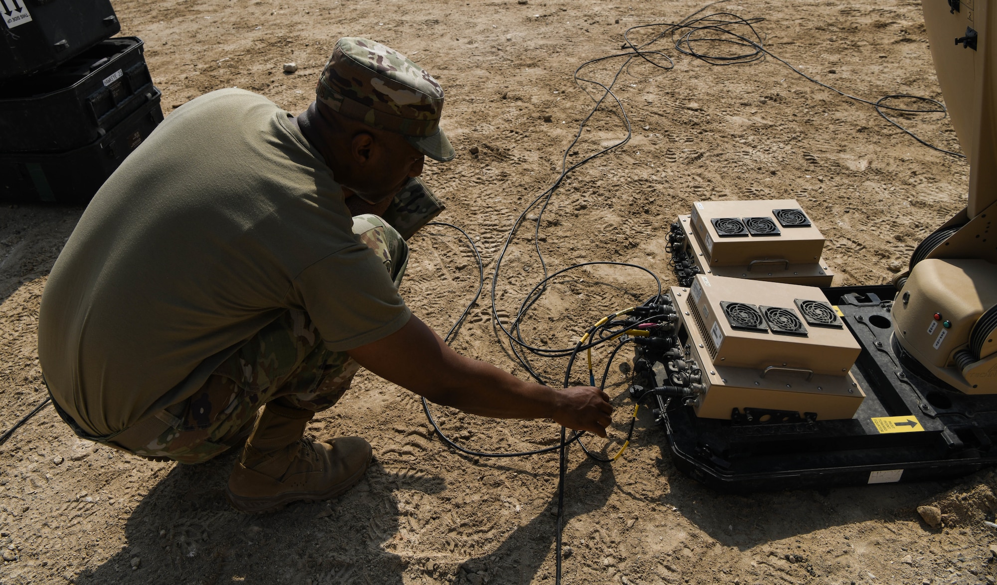 Chief Master Sgt. Raymond Artis, a member of the 380th Expeditionary Communications Squadron, monitors status reporting on the Hawkeye satellite communication system display, Aug. 19 2020 at Al Dhafra Air Base, United Arab Emirates.