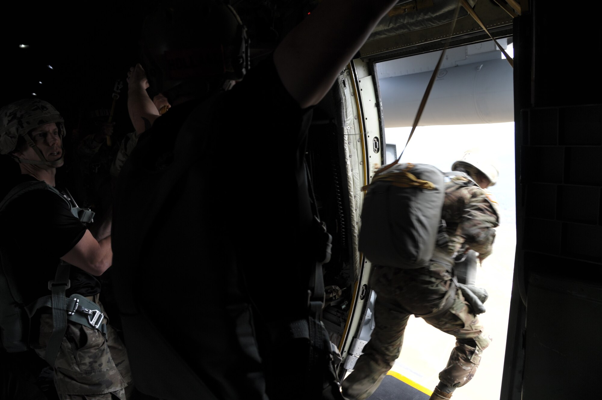 people jump out of an aircraft