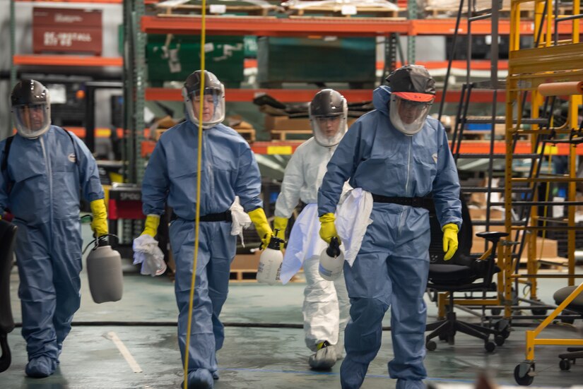 Photo of Personnel from Tobyhanna's Safety and Occupational Health Office mobilized to perform a deep clean