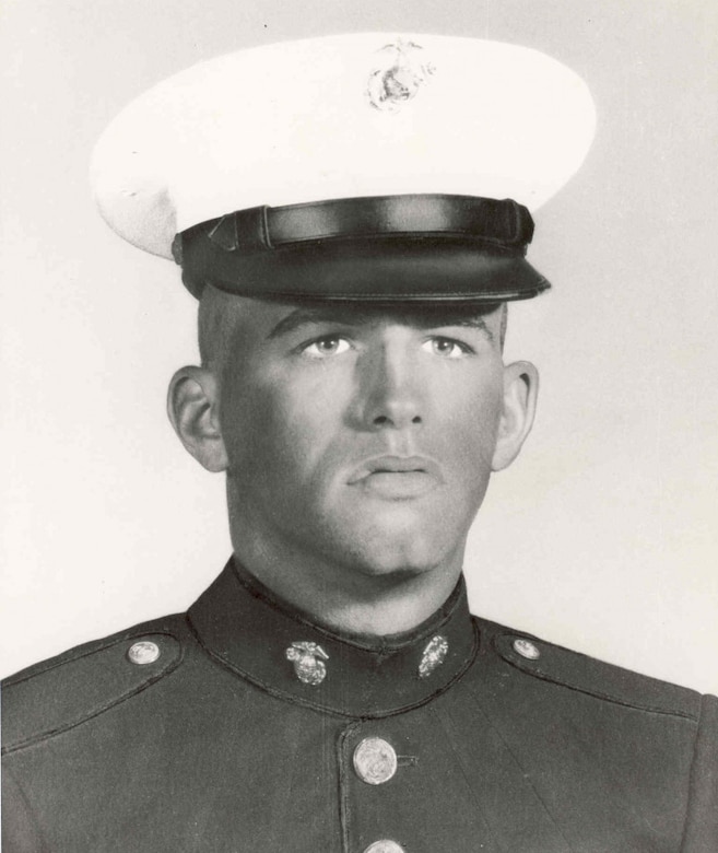 A man in uniform poses for an official photo.