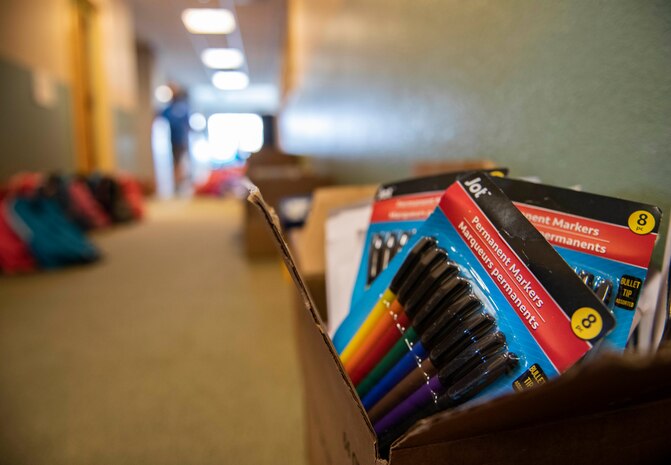School supplies sit ready to be packed into backpacks as part of the Back to School Brigade on Beale Air Force Base.