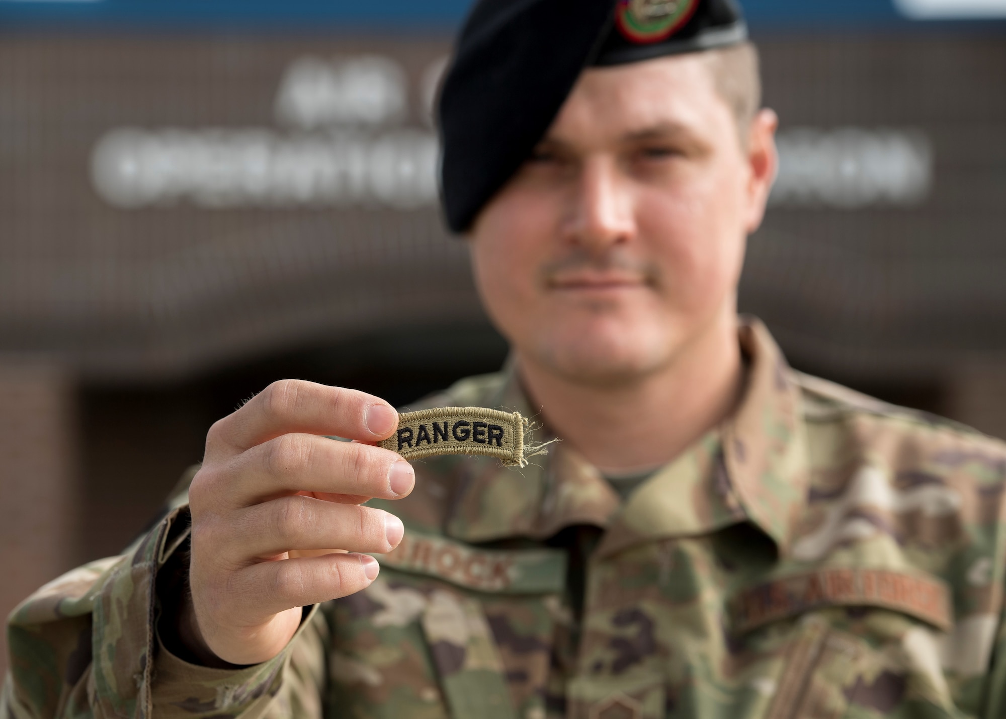 U.S. Air Force Master Sgt. Douglas Brock, a tactical air control party specialist with the 124th Air Support Operations Squadron, Idaho Air National Guard, holds up his ranger tab at Gowen Field, Boise, Idaho on April 17, 2019. Brock was selected as the Air National Guard 2020 Outstanding Senior Noncommissioned Officer of the Year. (U.S. Air National Guard photo by Master Sgt. Joshua C. Allmaras)