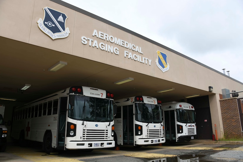 Medical transport buses await their departure to pick up patients arriving from Landstuhl Regional Medical Center in Kaiserslautern, Germany, at Joint Base Andrews, Md., Aug. 13, 2020. Buses are used to transport patients from the flight line at JBA, back to the Aeromedical Staging Facility or other nearby medical facilities. (U.S. Air Force photo by Airman 1st Class Spencer Slocum)