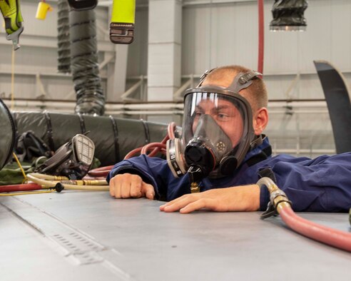 Air Force Reserve Staff Sgt. Tyler Blythe, 913th Maintenance Squadron, crawls out of the wing fuel tank of a C-130J Super Hercules after an inspection at Little Rock Air Force Base, Ark., Aug. 6, 2020. Blythe enlisted into the active duty Air Force at 18 years old as a maintenance crew chief stationed in Arizona. (U.S. Air Force Reserve photo by Maj. Ashley Walker)