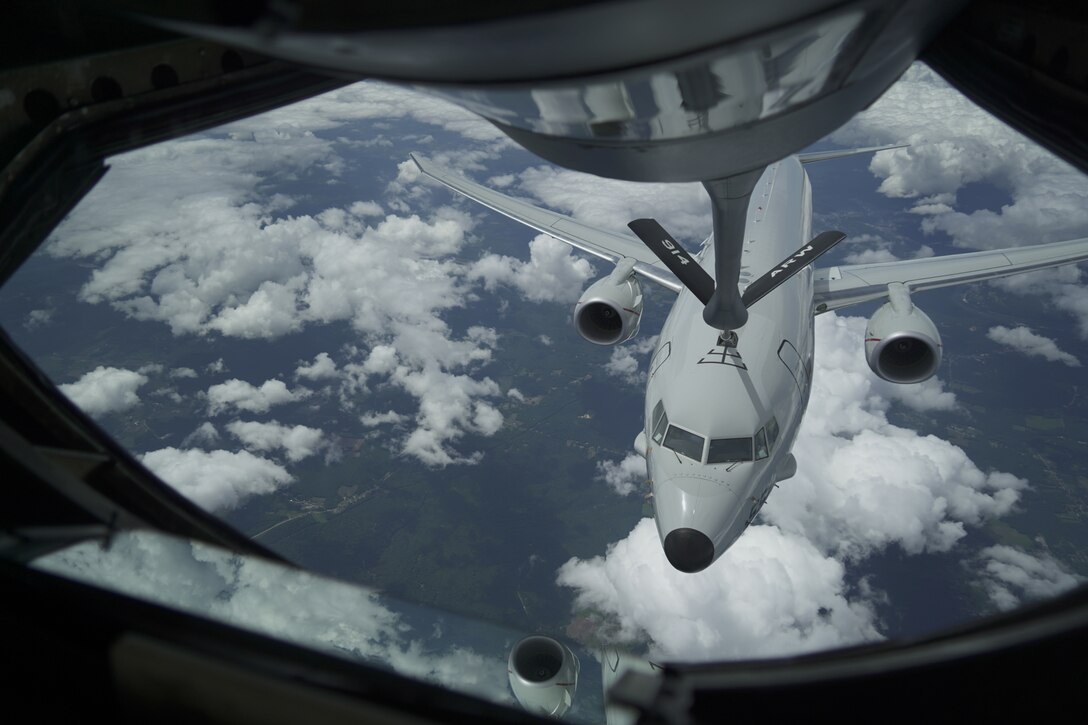 A plane gets refueled in midair.
