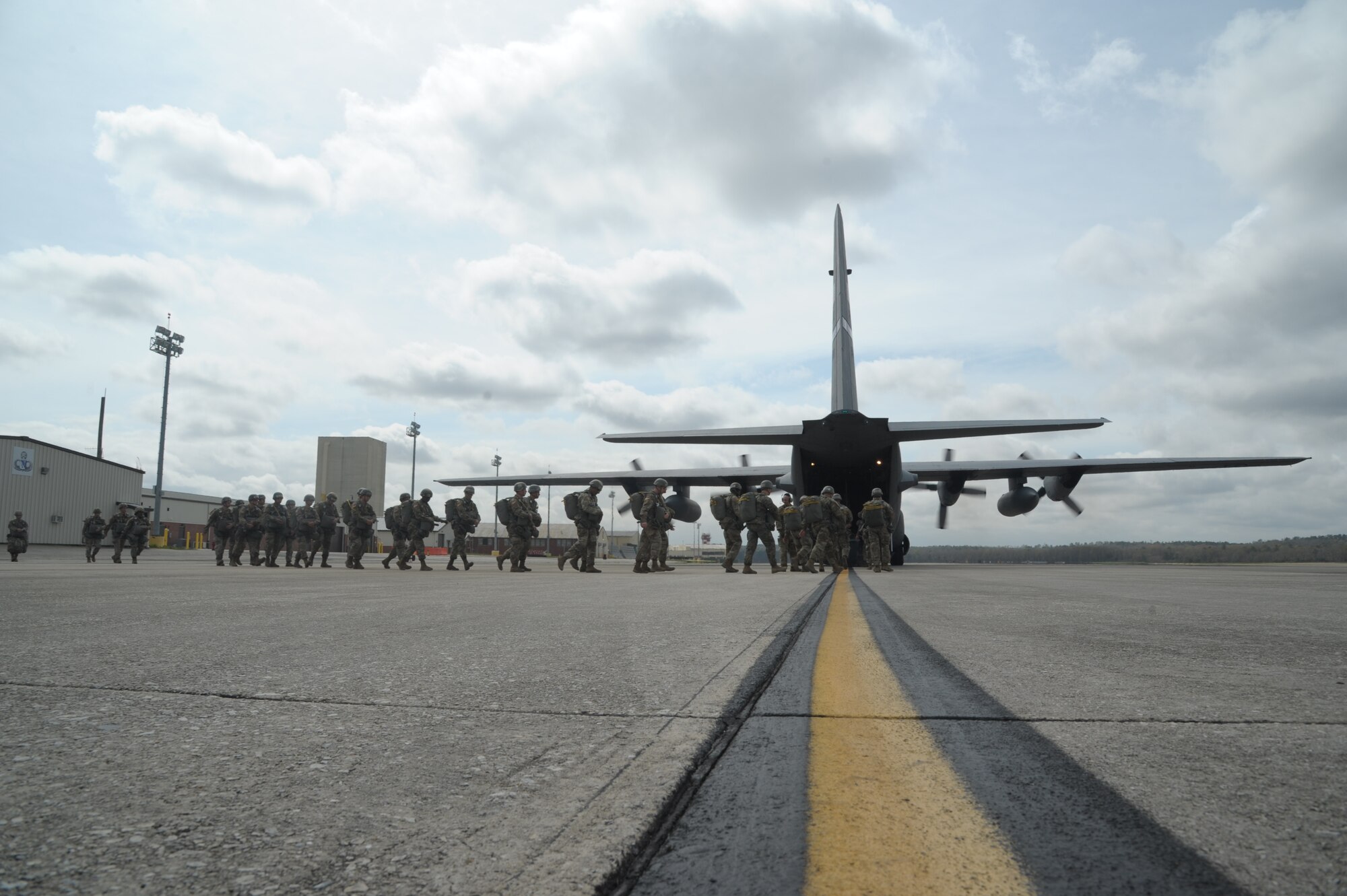 paratroopers prepare to load an aircraft