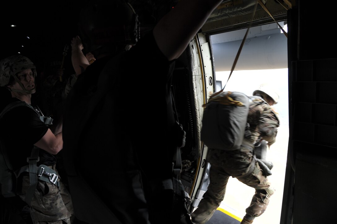 people jump out of an aircraft