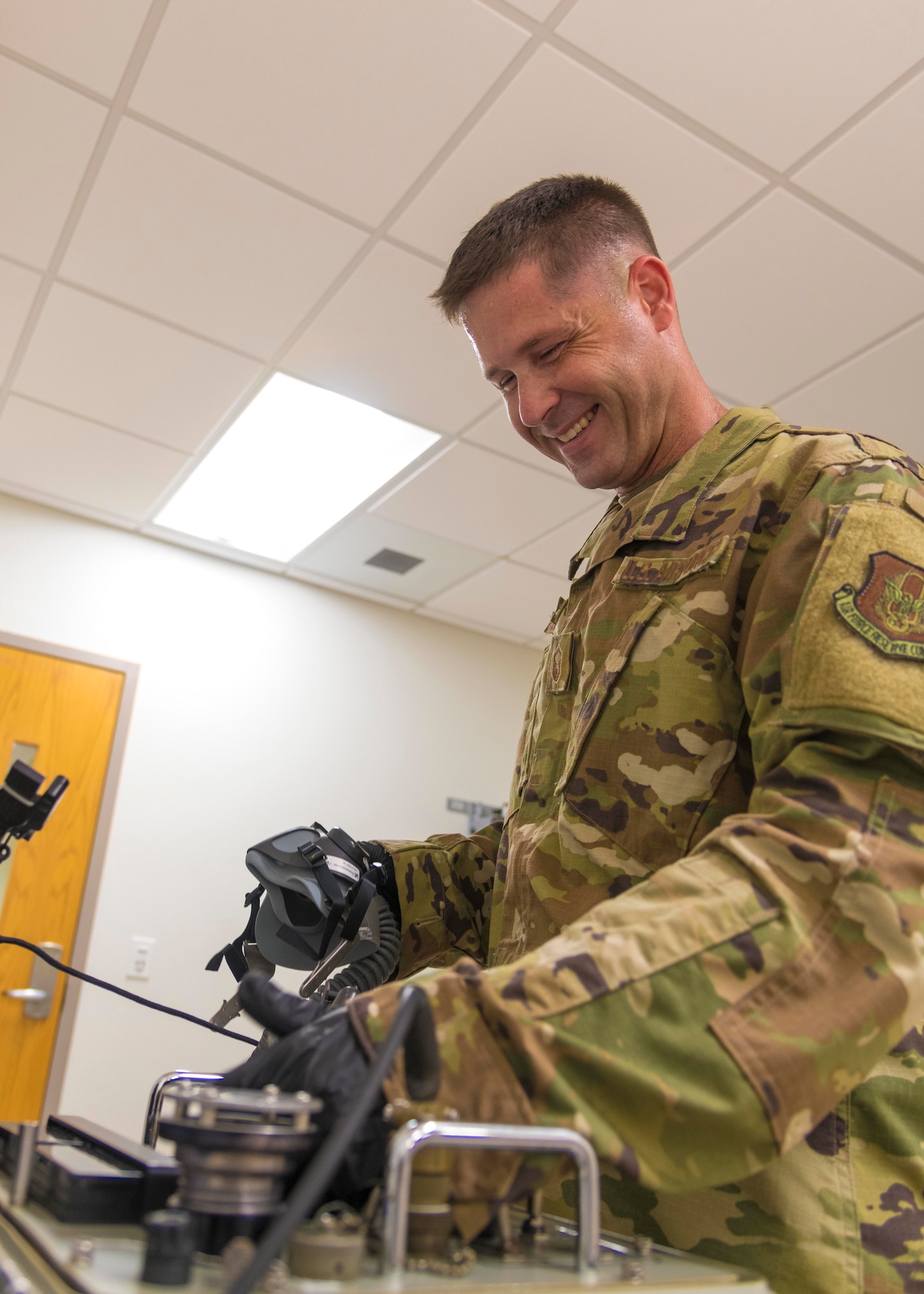 Air Force Reserve Master Sgt. David Underwood, 913th Aircrew Flight Equipment supervisor, inspects a flight helmet and oxygen equipment on July 16, 2020, at Little Rock Air Force Base, Ark. (U.S. Air Force Reserve photo by Maj. Ashley Walker)