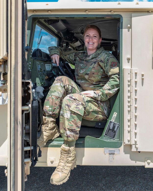 Air Force Reserve Staff Sgt. Tiah Phillips,steps out of the driver seat of a Humvee Aug. 2, 2020, at Little Rock Air Force Base, Ark. Earlier in her career she cross-trained into vehicle operations, where she deployed to Kuwait and Iraq in 2011. Phillips drove dozens of convoy missions in tractor trucks, bringing back heavy equipment from forward operating bases as operations were drawn down. (U.S. Air Force Reserve photo by Maj. Ashley Walker)