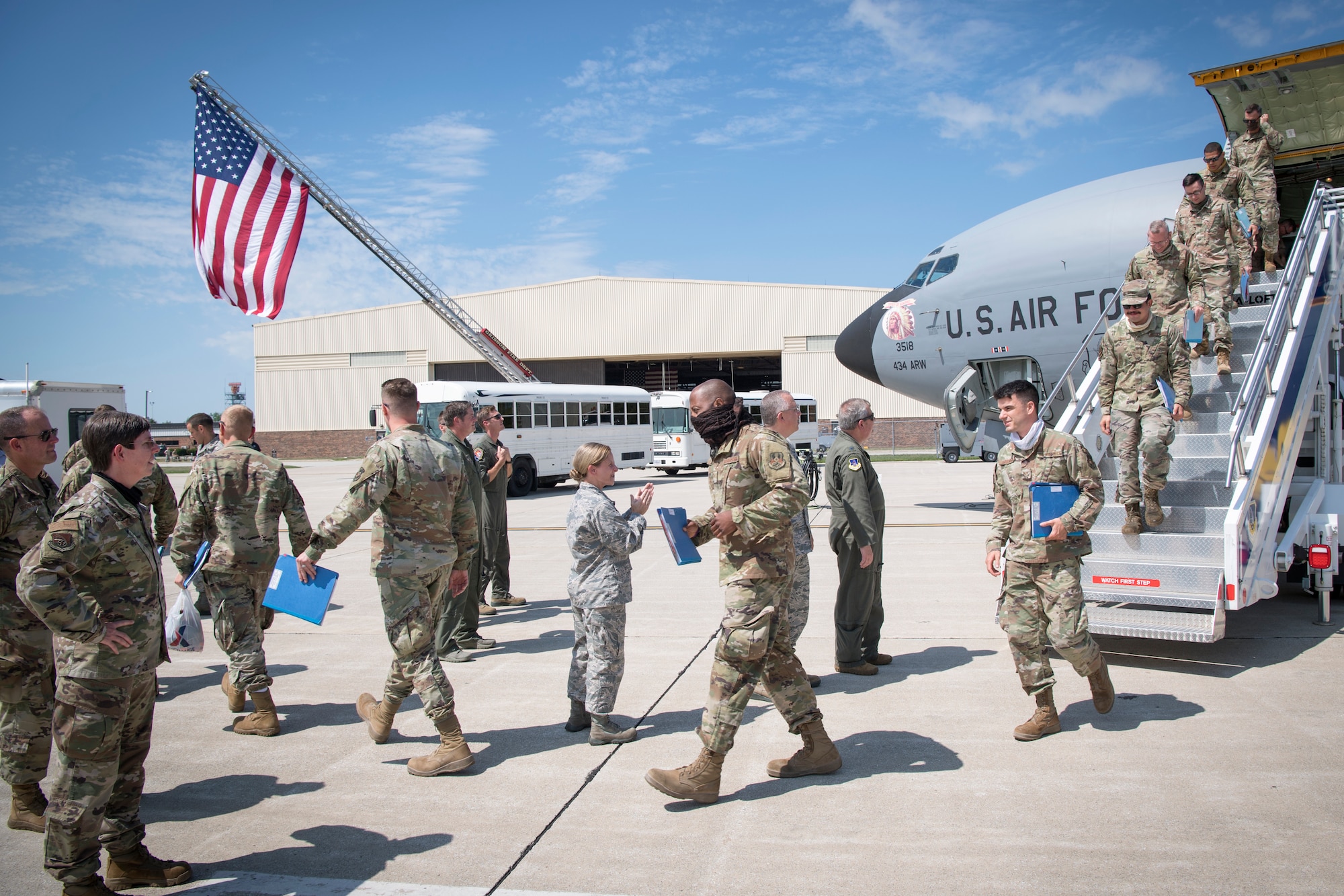 Personnel from the 434th Air Refueling Wing greet returning Airmen as they exit a KC-135R Stratotanker at Grissom Air Reserve Base, Ind., Aug. 14, 2020 following a deployment to Southwest Asia. The group of returning Airmen included members of the 434th Maintenance Group, 434th Maintenance Squadron, 434th Aircraft Maintenance Squadron, 74th Air Refueling Squadron and 434th Operational Support Squadron. (U.S. Air Force photo/Master Sgt. Ben Mota)