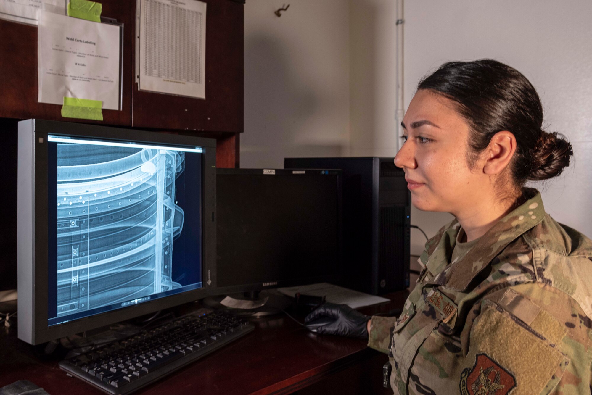 Air Force Reserve Staff Sgt. Valerie Sanchez, Air Reserve Technician and non-destructive inspection technician, reviews x-ray files of a aircraft part at Little Rock Air Force Base, Ark., on Aug. 6, 2020. NDI technicians use various methods to complete these inspections such as X-ray, florescent dye penetrate, oil analysis and ultrasonic scanning to examine and inspect numerous aircraft parts and components to ensure that they are in usable condition. (U.S. Air Force Reserve photo by Maj. Ashley Walker)