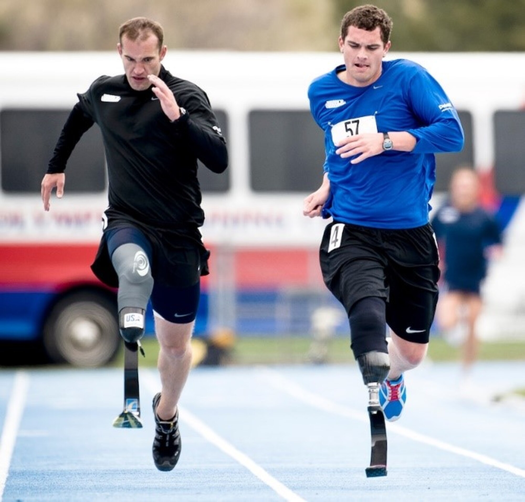 1st Lt. Ryan McGuire (right) sprints the last leg of the 1,500m dash to take fourth place during the Warrior Games May 14, 2010, in Colorado Springs, Colo. Members that are enrolled in the Air Force Wounded Warrior (AFW2) Program have been ill, inured or wounded in ways that were inevitable to avoid. To help them cope and grow accustomed to their new normal the AFW2 Recovering Airman Mentorship Program (RAMP) provides mentors who have walked those same footsteps. (U.S. Air Force photo/Tech. Sgt. Samuel Bendet)