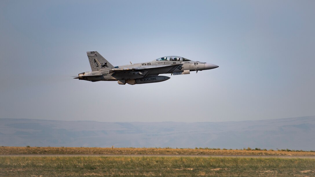 A U.S. Navy F/A-18 Hornet from the 213th Strike Fighter Squadron, takes flight for Gunfighter Flag 20-1, August 18, 2020, at Mountain Home Air Force Base, Idaho. GFF 20-1 provides units the opportunity to train with joint and international partners to complete combat and rescue exercises. (U.S. Air Force photo by Airman 1st Class Natalie Rubenak)