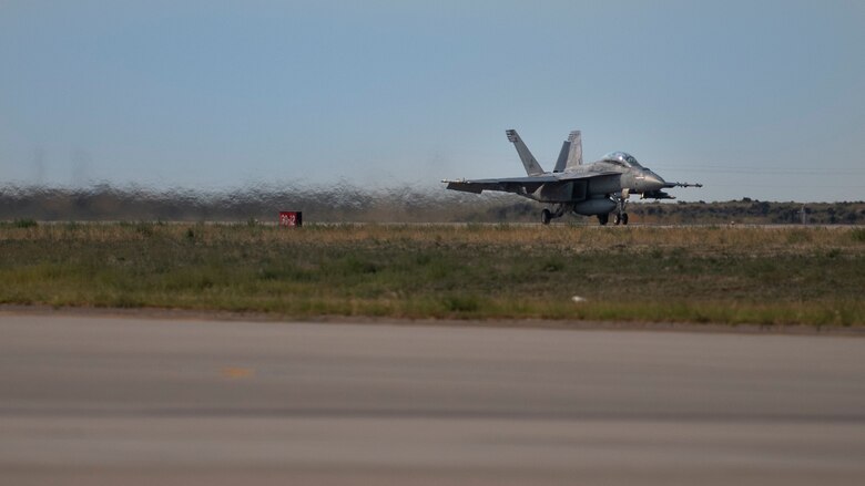 A U.S. Navy F/A-18 Hornet from the 213th Strike Fighter Squadron, prepares to take flight for Gunfighter Flag 20-1, Aug. 18, 2020, at Mountain Home Air Force Base, Idaho. GFF 20-1 provides units the opportunity to train with joint and international partners to complete combat and rescue exercises. (U.S. Air Force photo by Airman 1st Class Natalie Rubenak)