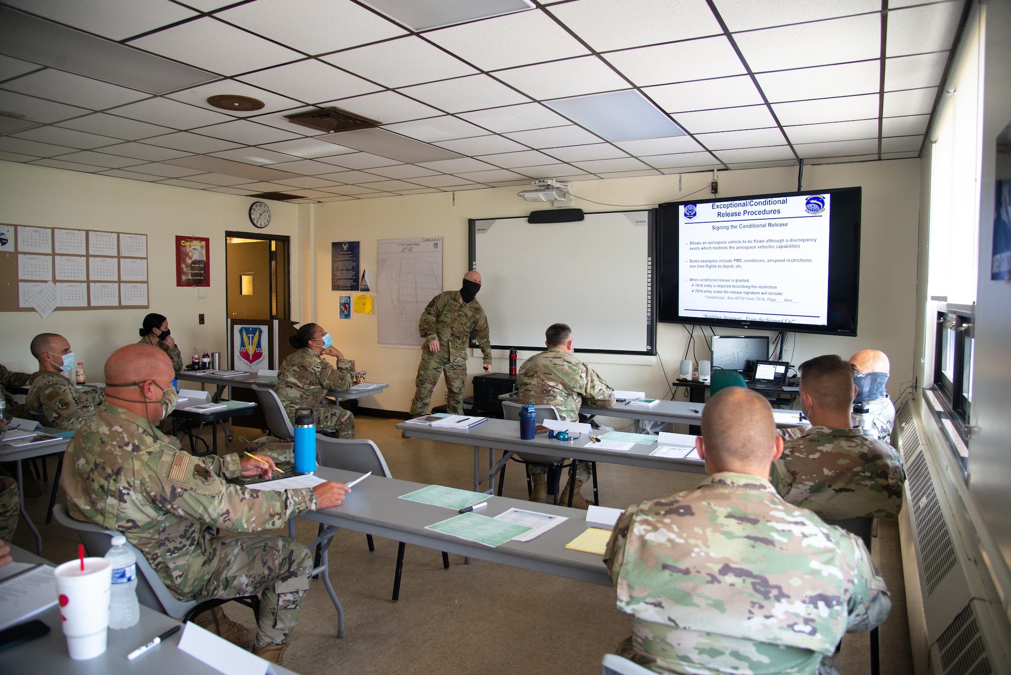 A photo of SMSgt. Dean L. Couch teaching 177th Aircraft Maintenance Squadron members.