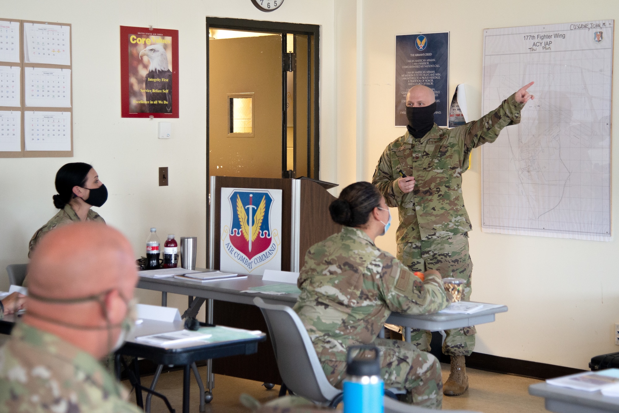 A photo of SMSgt. Dean L. Couch teaching 177th Aircraft Maintenance Squadron members.