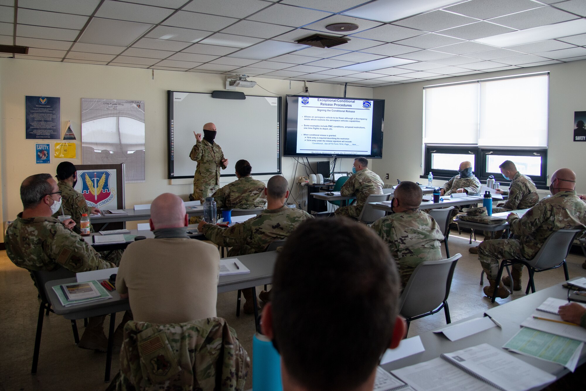 A photo of SMSgt. Dean L. Couch teaching 177th Aircraft Maintenance Squadron members.