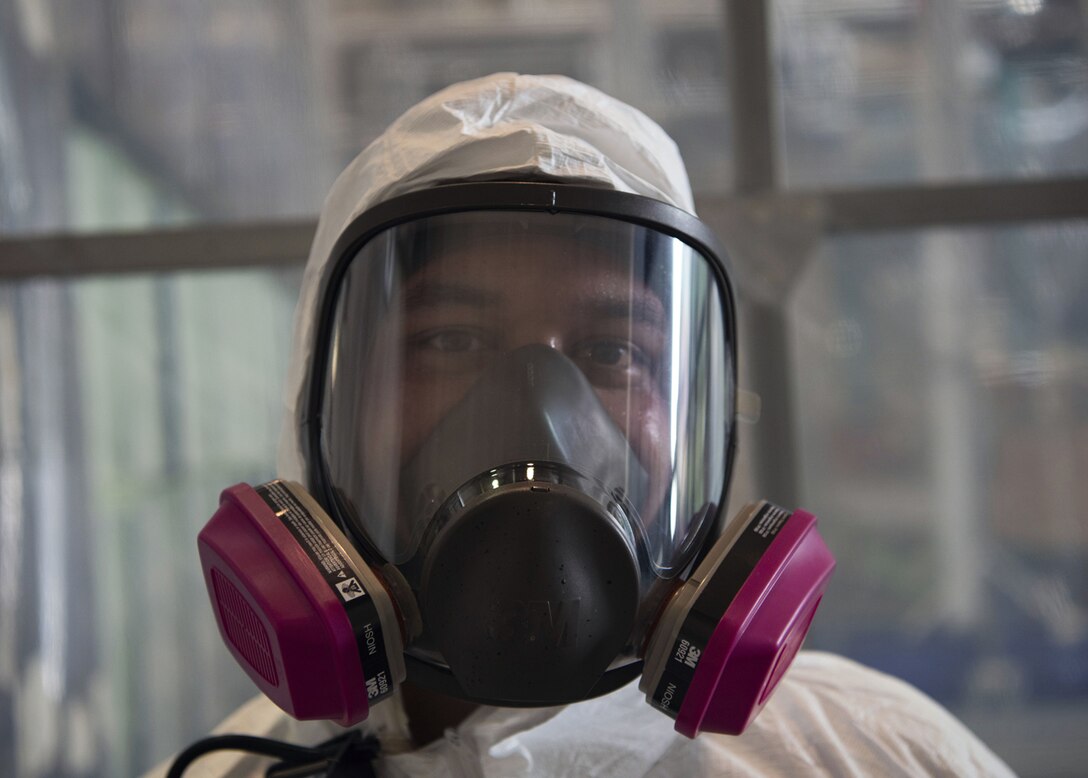 Tech. Sgt. Derek Spencer, Aircraft Structural Maintenance Craftsman 374th Maintenance Squadron Fabrication Shop, shows off his Personal Protective Equipment gear at Yokota Air Base, Japan, August 12, 2020.