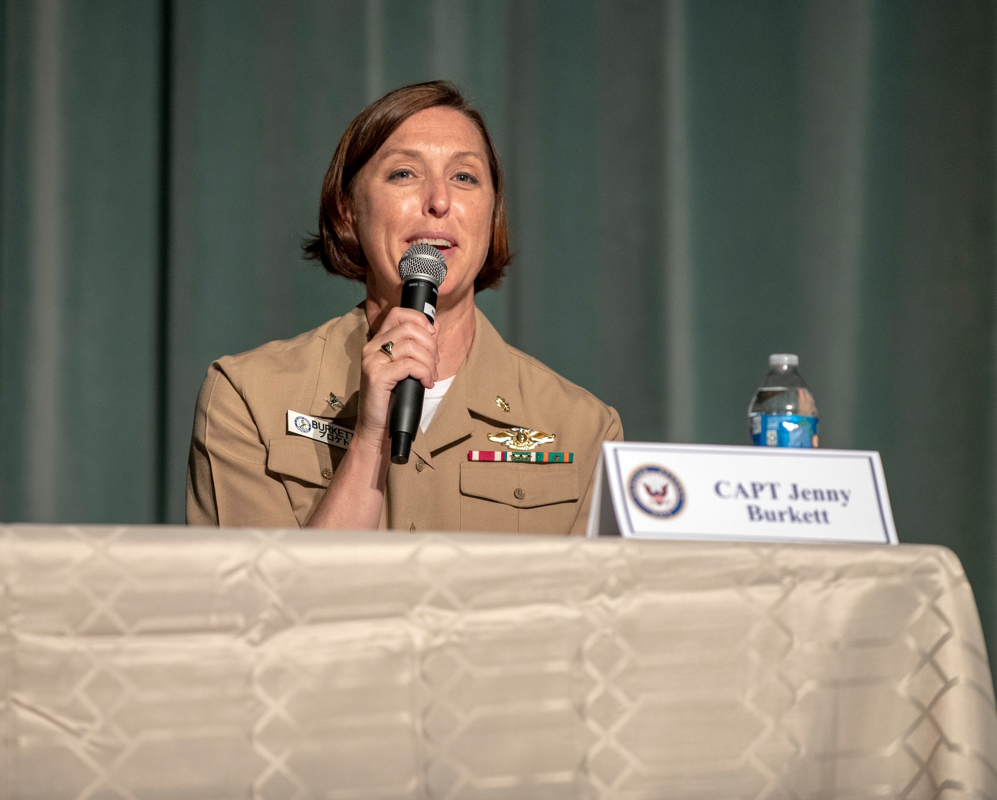 U.S. Navy Capt. Jenny Burkett, Navy Hospital Okinawa interim executive officer, shares her experience during the Women's Leadership Panel at Kadena Air Base, Japan, Aug. 19, 2020. The program acknowledged and raised awareness of the long strides the US has taken to afford women the same allowances as men. (U.S. Air Force photo by Naoto Anazawa)