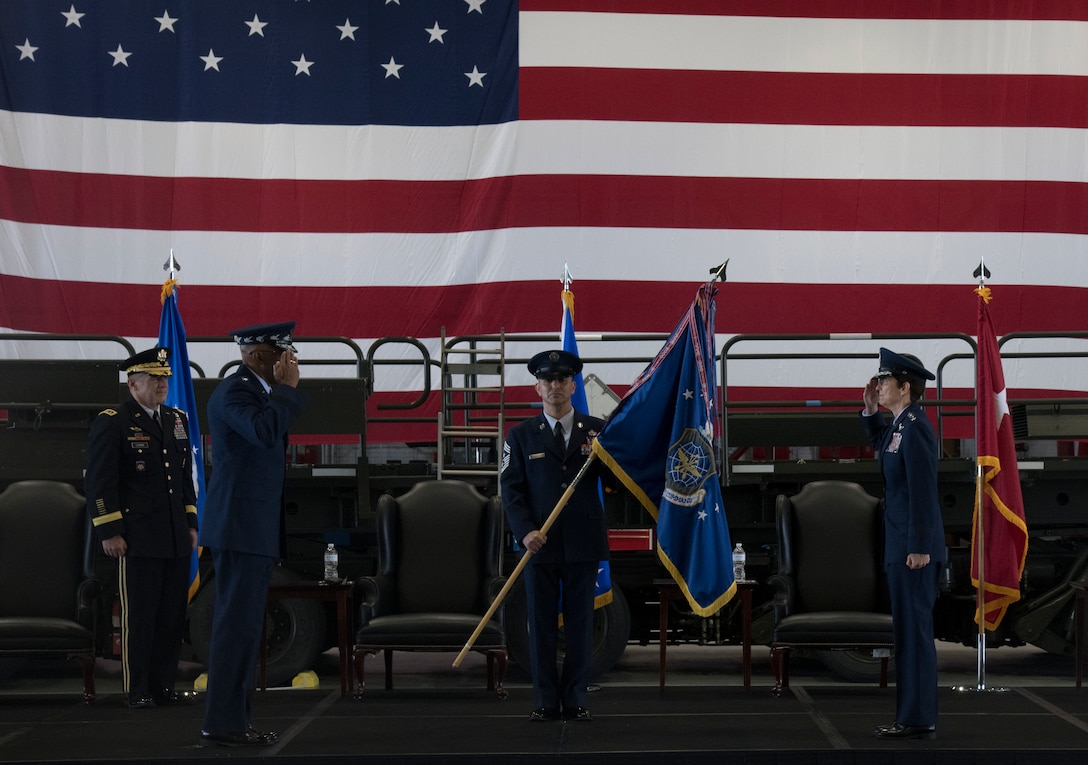 Gen. Jacqueline D. Van Ovost, commander of Air Mobility Command, right, salutes Gen. Charles Q. Brown, Jr., Chief of Staff of the Air Force, during the AMC change of command ceremony at Scott Air Force Base, Illinois, Aug. 20, 2020. The ceremony marked a historic Air Force first with back-to-back female generals commanding a major command.. (U.S. Air Force photo by Senior Airman Solomon Cook)