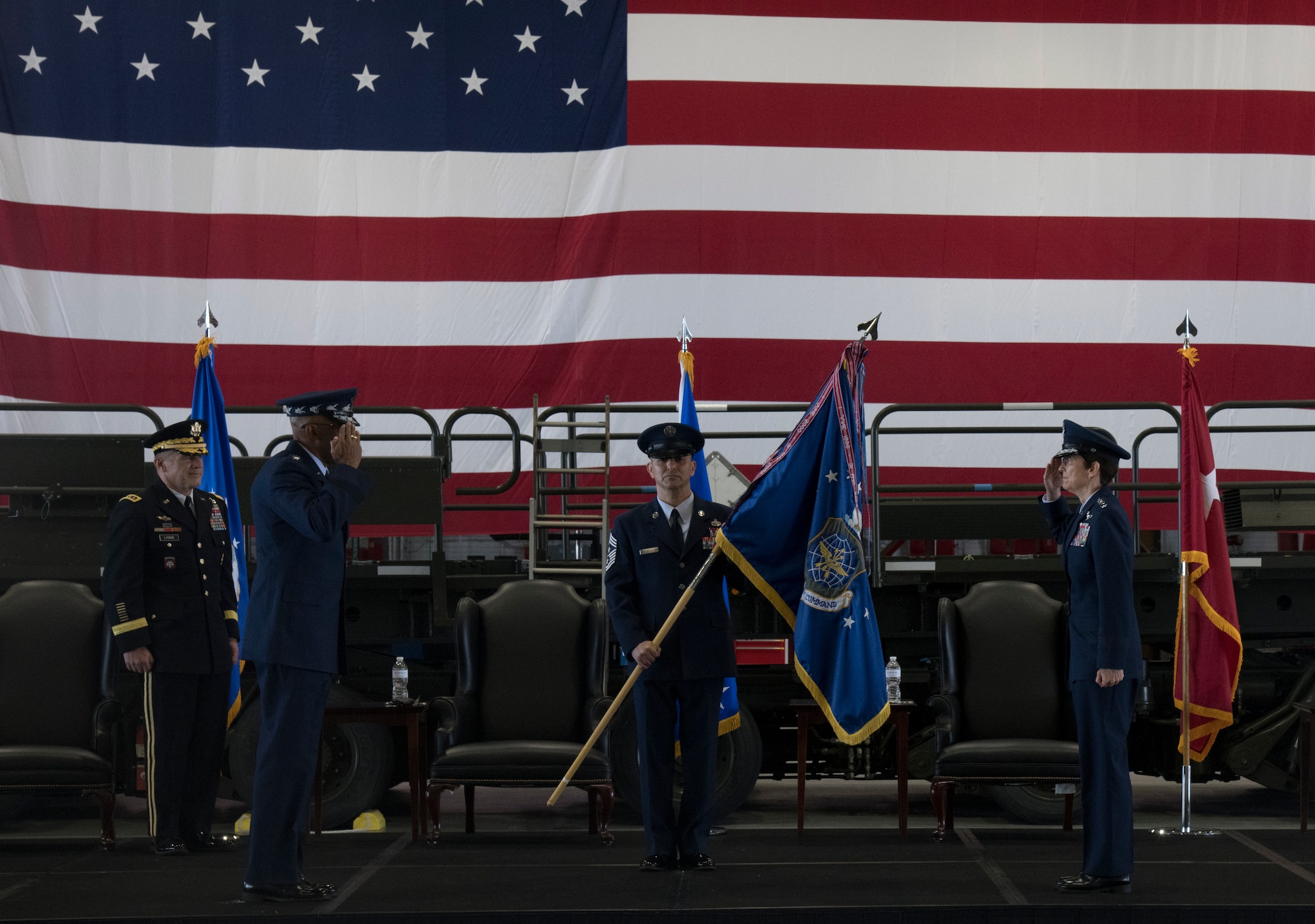 Gen. Jacqueline D. Van Ovost, commander of Air Mobility Command, right, salutes Gen. Charles Q. Brown, Jr., Chief of Staff of the Air Force, during the AMC change of command ceremony at Scott Air Force Base, Illinois, Aug. 20, 2020. The ceremony marked a historic Air Force first with back-to-back female generals commanding a major command.. (U.S. Air Force photo by Senior Airman Solomon Cook)