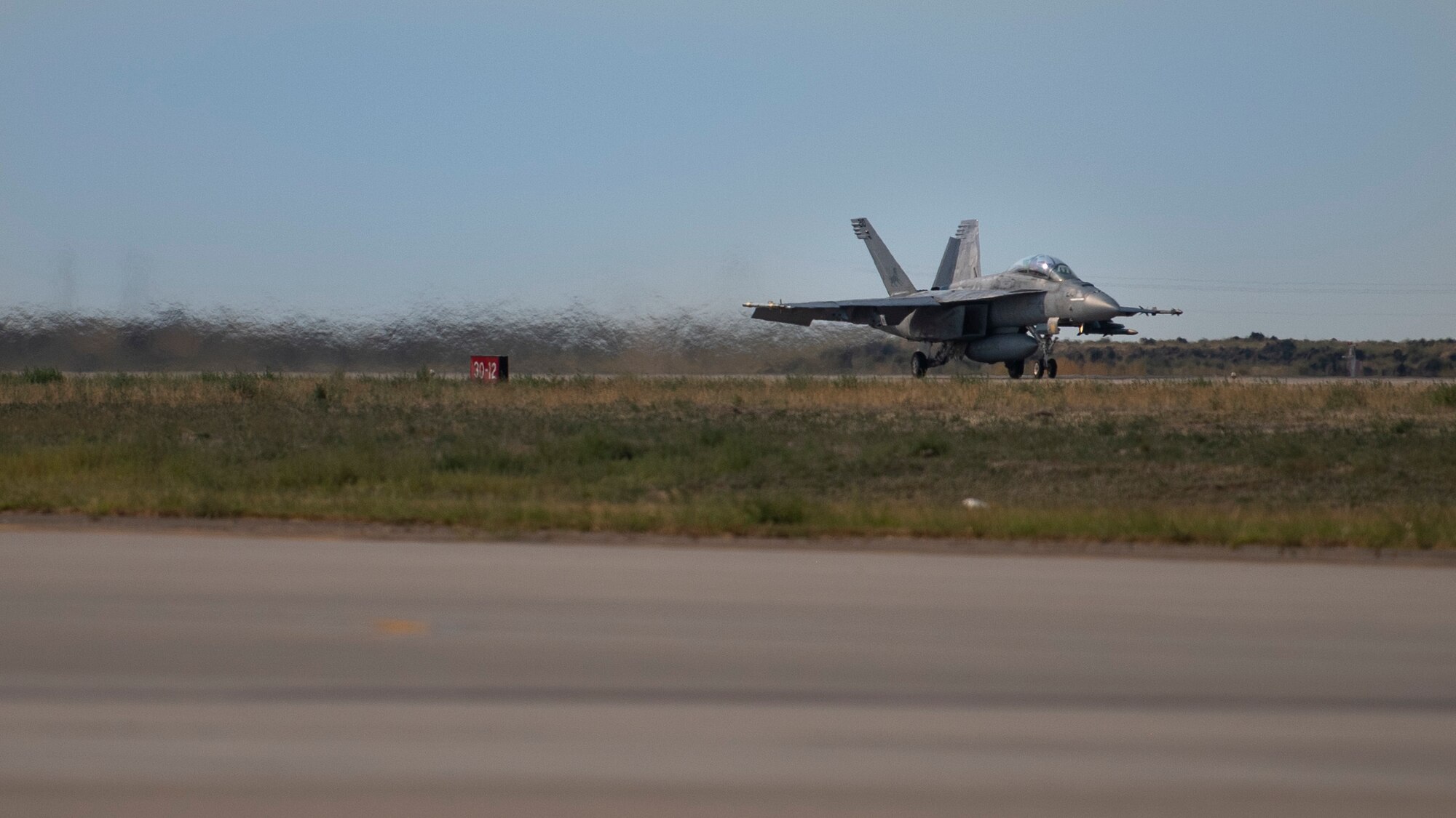 A U.S. Navy F/A-18 Hornet from the 213th Strike Fighter Squadron, prepares to take flight for Gunfighter Flag 20-1, Aug. 18, 2020, at Mountain Home Air Force Base, Idaho. GFF 20-1 provides units the opportunity to train with joint and international partners to complete combat and rescue exercises. (U.S. Air Force photo by Airman 1st Class Natalie Rubenak)