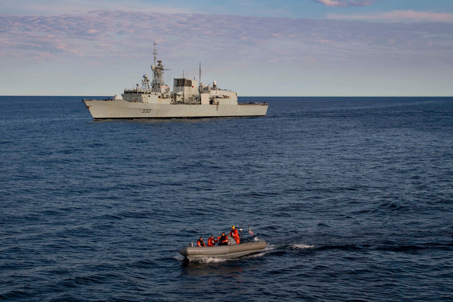 HMCS Ville de Québec (FFH 332) transits the Atlantic Ocean as U.S. Navy Sailors conduct small boat operations.