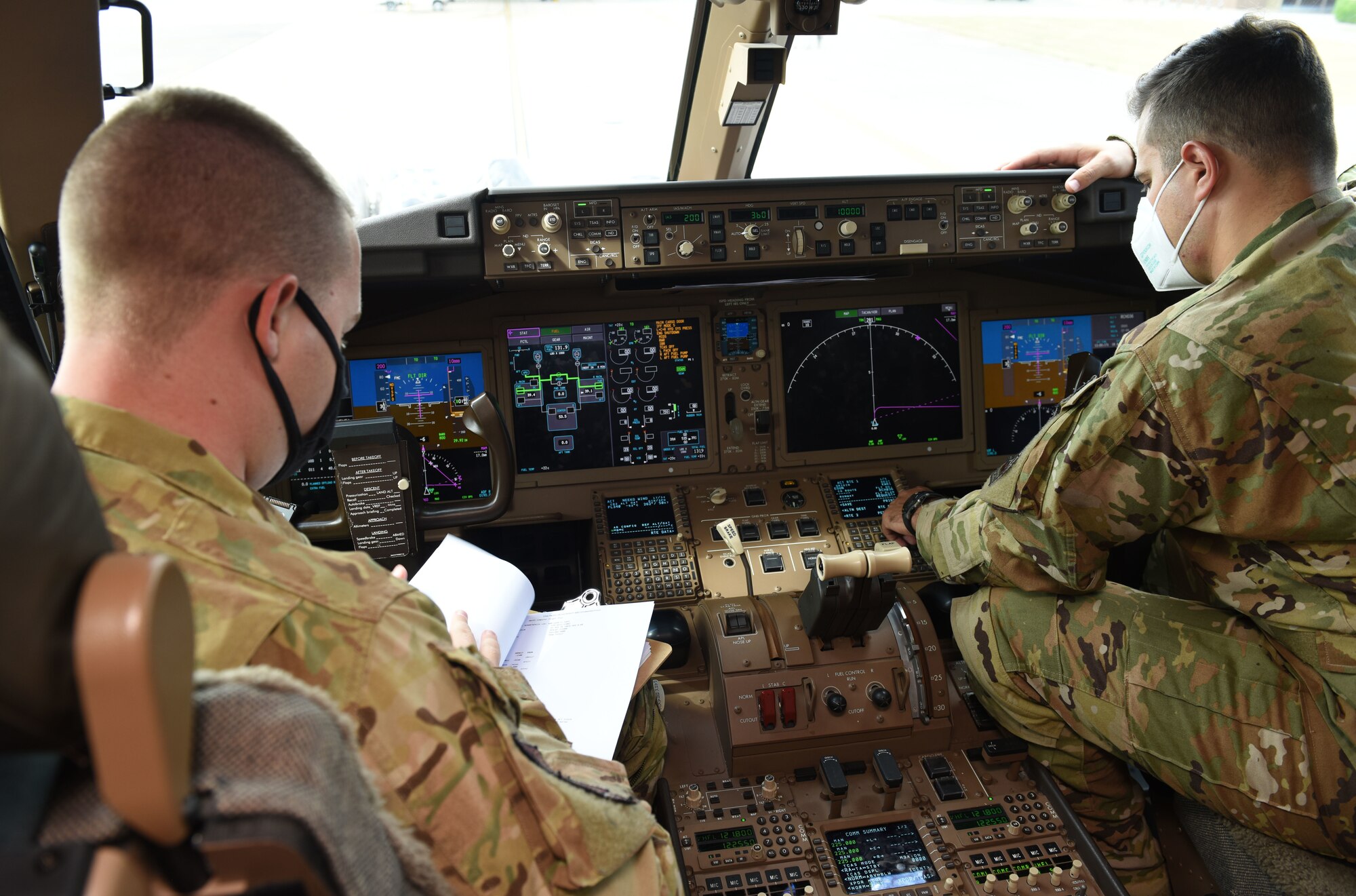 Aircrew from McConnell Air Force Base, Kansas, perform pre-flight checks on a KC-46A Pegasus it sits on the flightline at RAF Mildenhall, England, Aug. 18, 2020. Aircrew and crew chiefs, along with two KC-46s, spent time here to train alongside KC-135 Stratotanker aircrew. The KC-46 has undergone extensive testing this past year, and the successful completion of its first aeromedical evacuation in July 2020 represents a significant milestone in the aircraft’s ability to demonstrate one of its three mission sets: aerial refueling, airlift and aeromedical evacuation. (U.S. Air Force photo by Karen Abeyasekere)