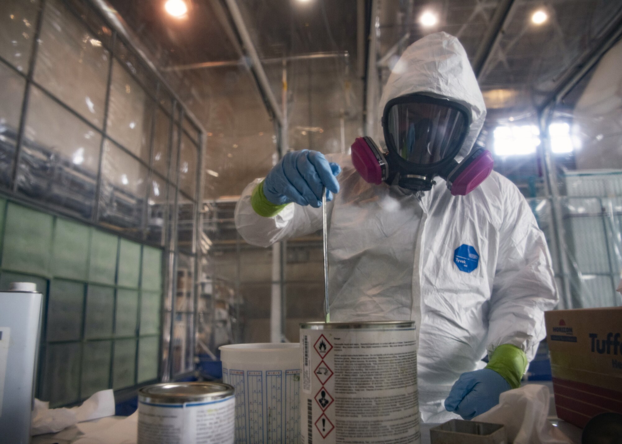 Staff Sgt. Alex Poteet, Aircraft Structural Maintenance Craftsman 374th Maintenance Squadron Fabrication Shop, mixes paint primer before applying to the CV-22 blade at Yokota Air Base, Japan, August 12, 2020.