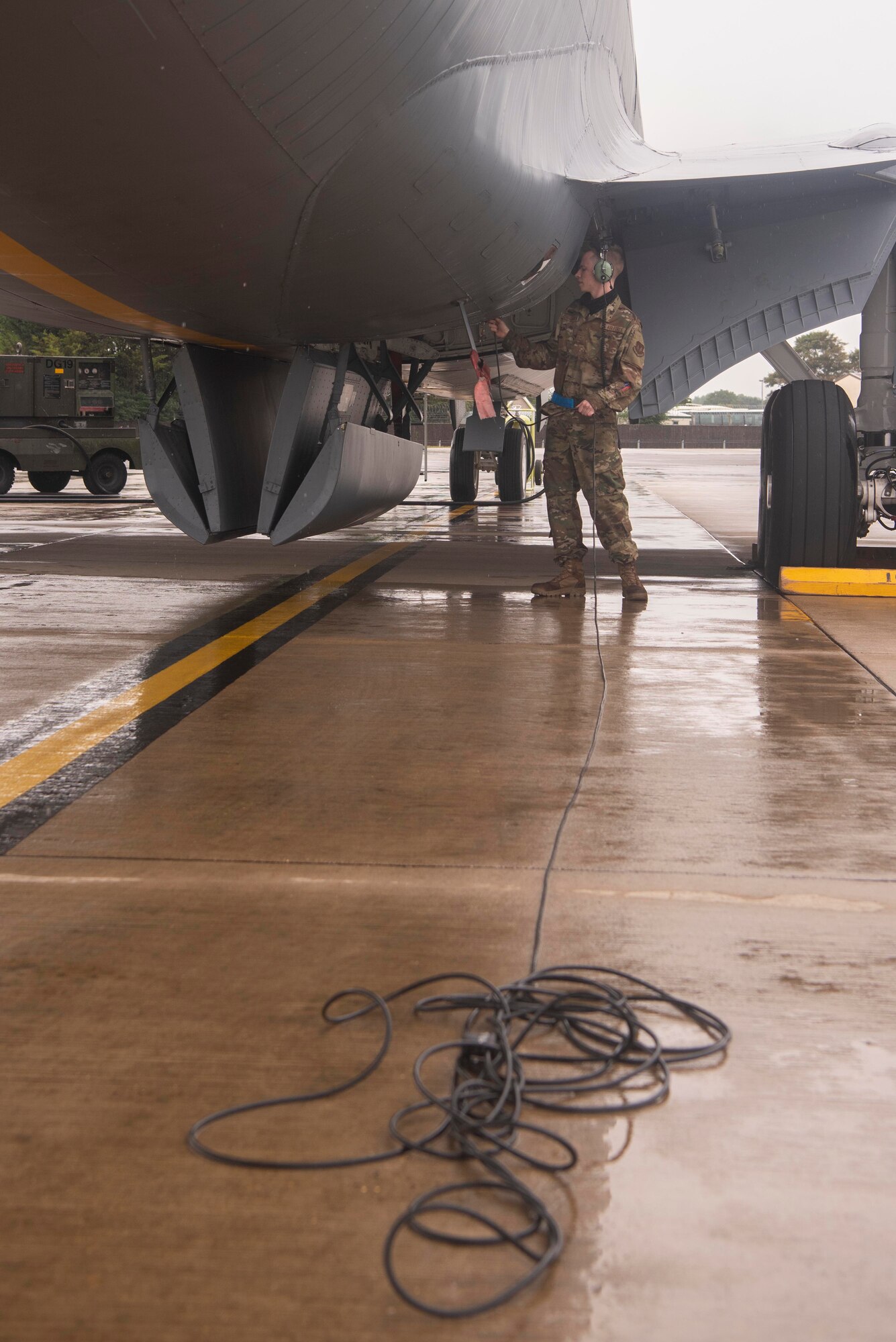 Airman Drake Koenig-Frederickson, 100th Aircraft Maintenance Squadron aerospace propulsion journeyman, plugs into the communication system of a KC-135 Stratotanker aircraft before the arrival of aircrew members at Royal Air Force Mildenhall, England, Aug. 19, 2020. The 100th Air Refueling Wing conducts air refueling and combat support operations throughout the European and African area of responsibility. (U.S. Air Force photo by Airman 1st Class Joseph Barron)