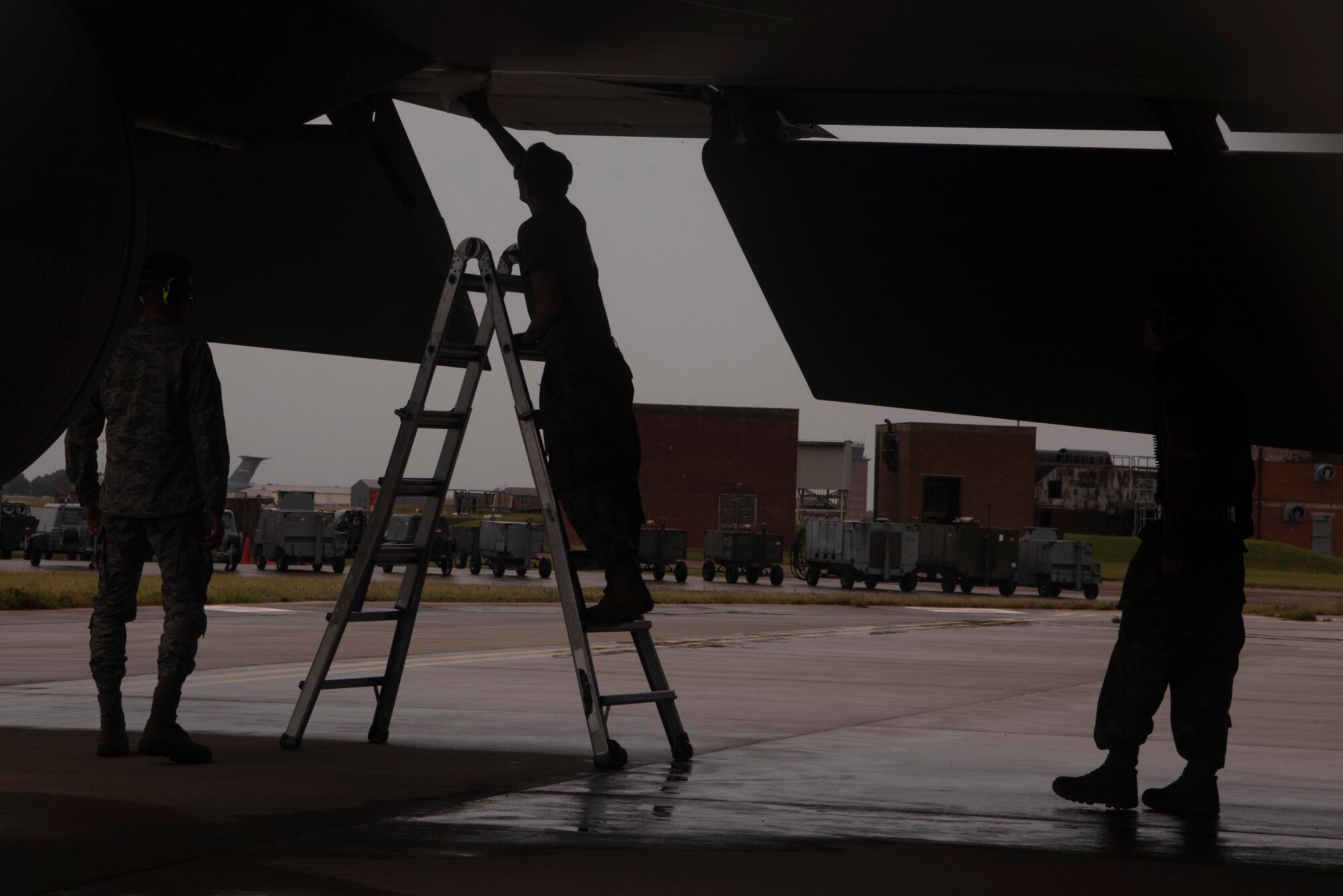 Aerospace propulsion Airmen with the 100th Aircraft Maintenance Squadron wipe hydraulic fluid from the underside of the wing of a KC-135 Stratotanker aircraft to prepare it for a training mission at Royal Air Force Mildenhall, England, Aug. 19, 2020. The KC-135 provides global, rapid aerial refueling capability for Europe and Africa as the only permanent air refueling wing. (U.S. Air Force photo by Airman 1st Class Joseph Barron)