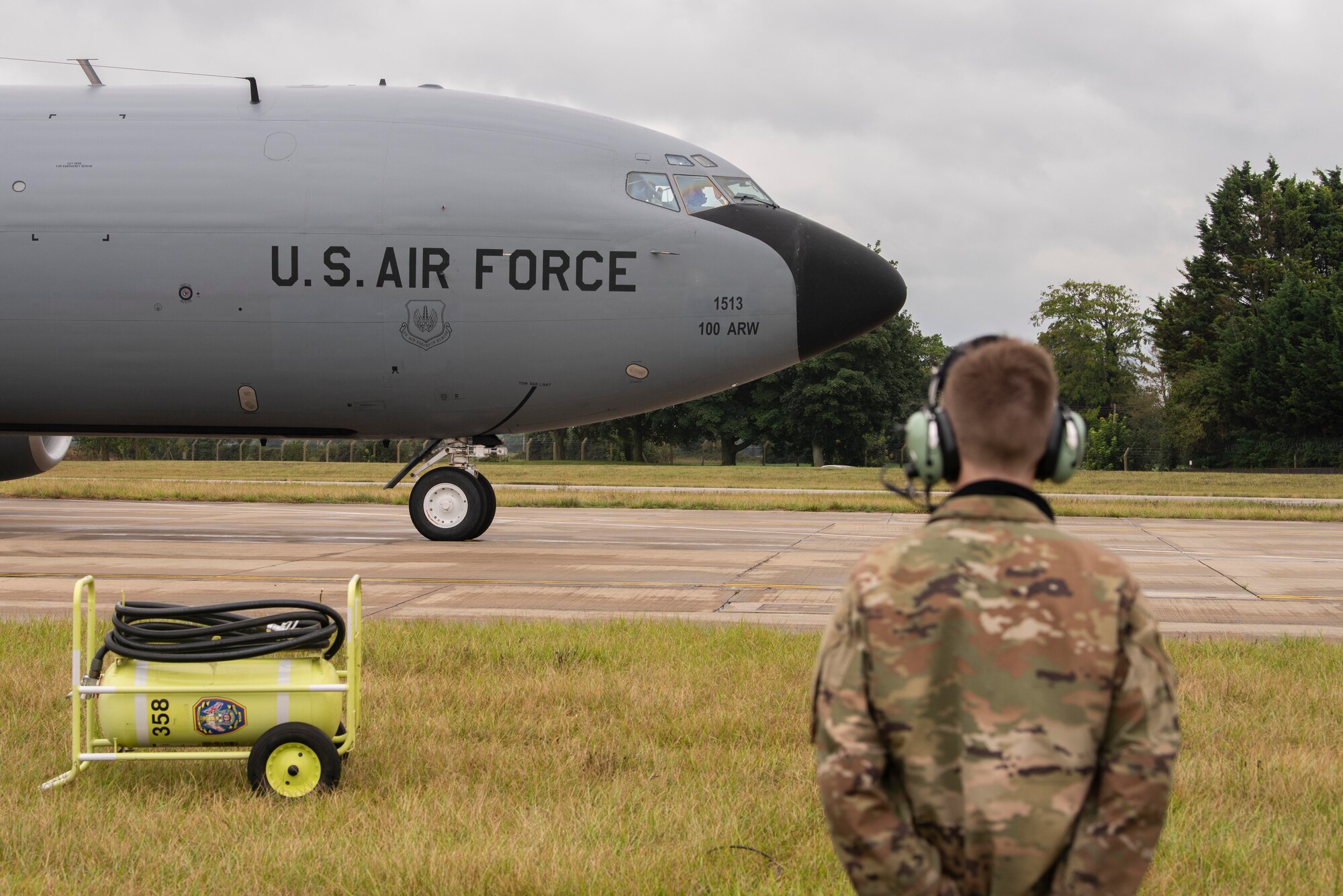 Airman Drake Koenig-Frederickson, 100th Aircraft Maintenance Squadron aerospace propulsion journeyman, awaits the launch of a KC-135 Stratotanker aircraft slated to conduct air refueling operations at Royal Air Force Mildenhall, England, Aug. 19, 2020. The 100th Air Refueling Wing conducts air refueling and combat support operations throughout the European and African area of responsibility. (U.S. Air Force photo by Airman 1st Class Joseph Barron)