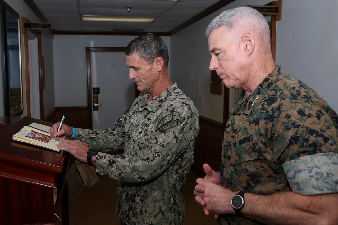 Lt. Gen. Brian Beaudreault, commanding general of II Marine Expeditionary Force, shakes hands with Vice Adm. Andrew Lewis, commander of 2nd Fleet and NATO Joint Force Command Atlantic, while visiting the II MEF headquarters building on Camp Lejeune, N.C. August 20, 2020. Vice Adm. Lewis visited to discuss blue-green integration while working towards future operations and interoperability. (U.S. Marine Corps photo by Sgt. Jonathon Wiederhold)