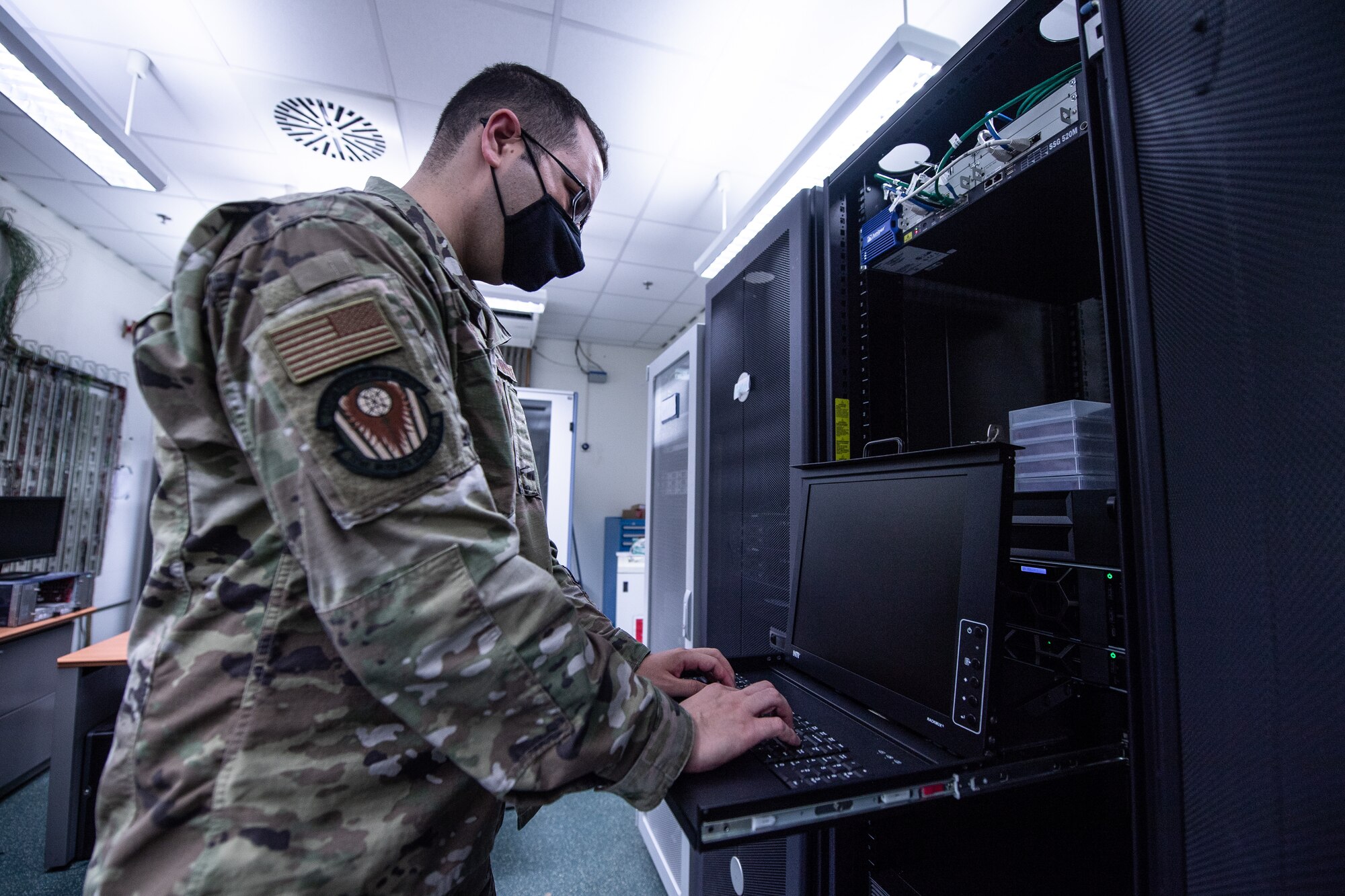 Photo of Airman on computer