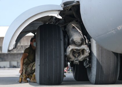 Airman 1st Class Brian Ireta, an aerospace mechanic assigned to the 437th Aircraft Maintenance Squadron, checks the tire pressure on a C-17 Globemaster III at Joint Base Charleston, S.C., Aug. 18, 2020. The 437th AMXS inspects, services, and maintains the assigned C-17 aircraft at Joint Base Charleston.