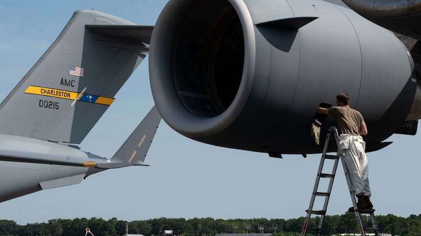 Staff Sgt. Jacob Songer, a crew chief assigned to the 437th Aircraft Maintenance Squadron, inspects an engine mounted on a C-17 Globemaster III at Joint Base Charleston, S.C., Aug. 18, 2020. The 437th AMXS inspects, services, and maintains the assigned C-17 aircraft at Joint Base Charleston.