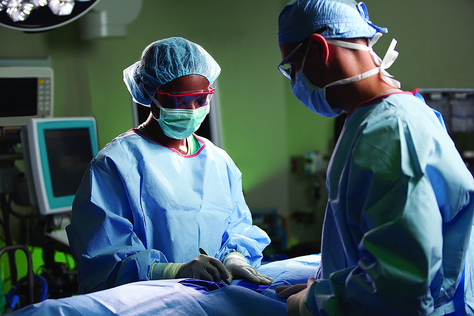 Surgeons perform a procedure at Brooke Army Medical Center, Joint Base San Antonio-Fort Sam Houston, Texas.