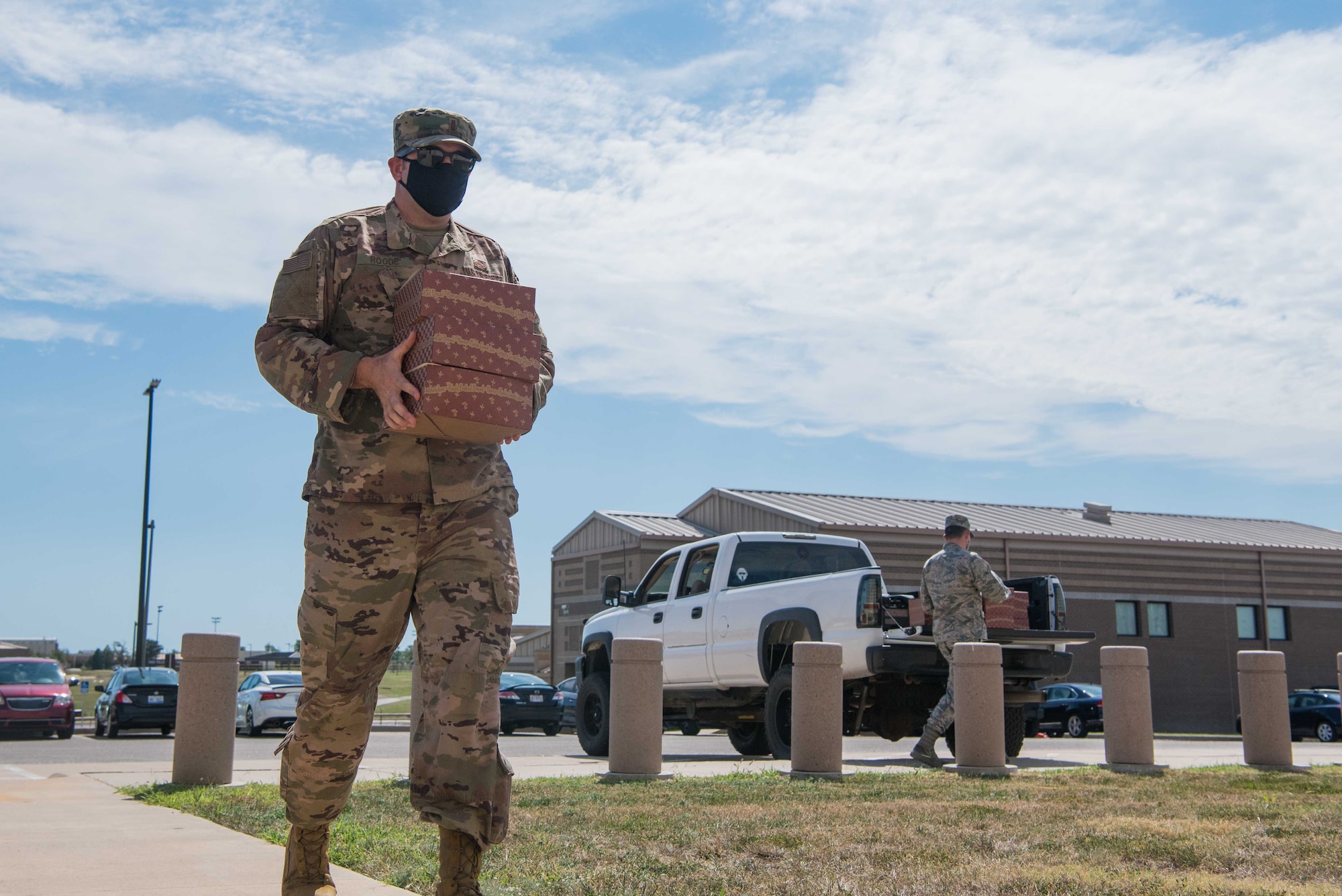 2nd Lt. Scott Roode, 22nd Force Support Squadron food operation officer, delivers boxed lunches to the alert facility during the Operational Readiness Inspection Aug. 19, 2020, at McConnell Air Force Base, Kansas. The ORI allows alert crews to demonstrate their ability to mobilize personnel, cargo and successfully generate aircraft. (U.S. Air Force photo by Senior Airman Alexi Bosarge)