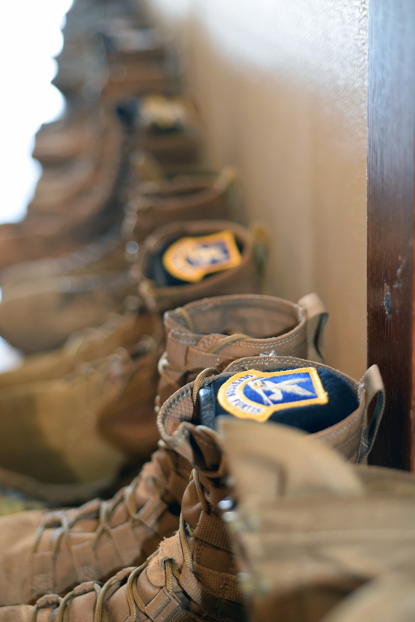 Phoenix Raven Qualification Course students’ boots line the hallway leading to the U.S. Air Force Expeditionary Center’s Redman Room, Aug. 12, 2020, at Joint Base McGuire-Dix-Lakehurst, New Jersey.  The course, which ran from July 27 to Aug, 19, qualifies selected security forces personnel to perform as members of a force protection team assigned to deploy with Department of Defense aircraft to austere environments. Students are trained to perform as teams to detect, deter, and counter threats to personnel/aircraft at deployed locations by performing close-in aircraft security and advising aircrew on force protection measures. In addition, the course prepares students to conduct/report airfield assessments and perform flight deck denial duties on select missions. (U.S. Air Force photo by Maj. George Tobias)