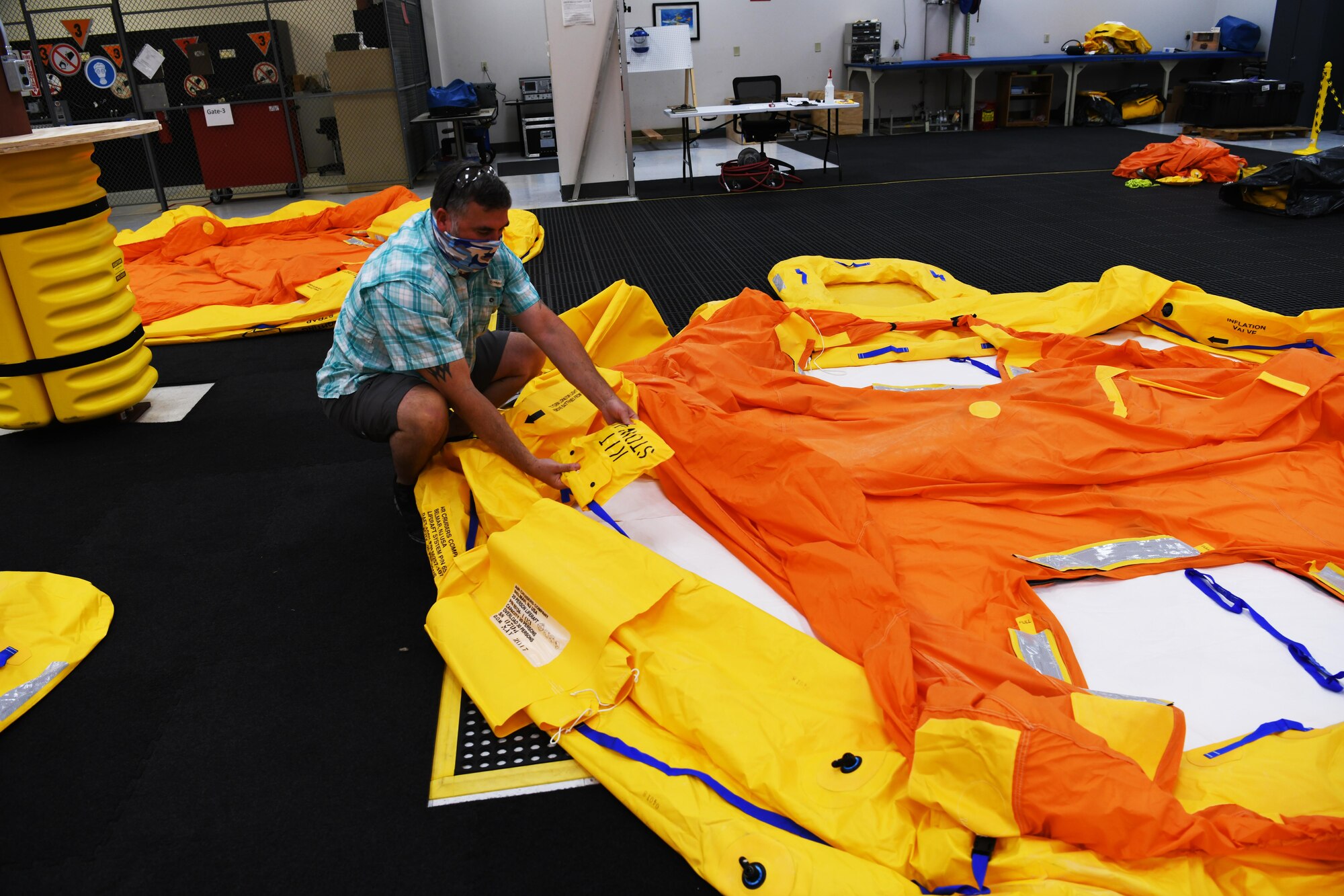 Technician with life raft