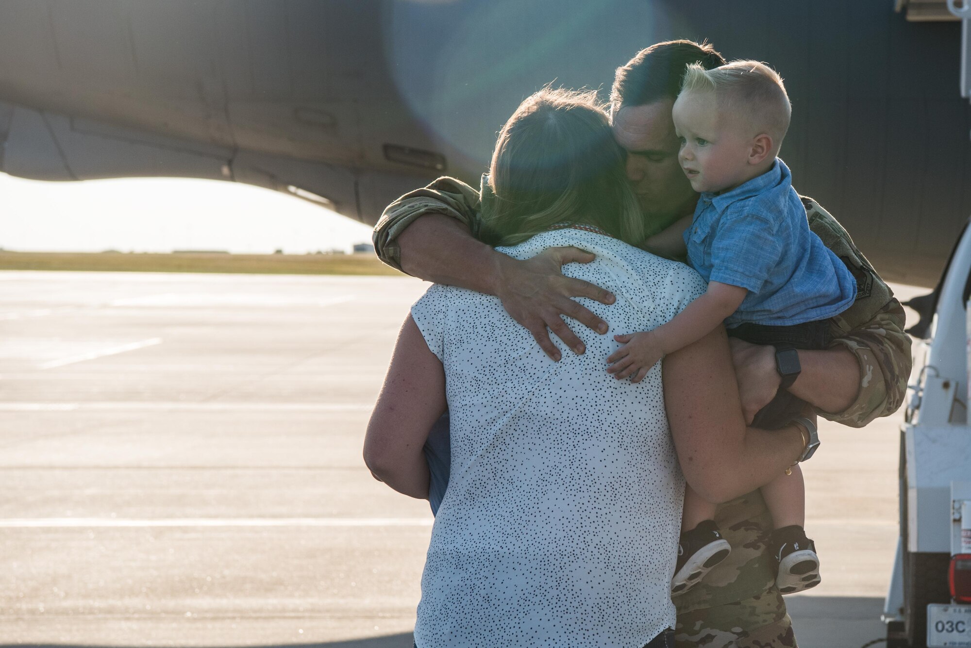 1st Lt. Jared Smithson, 349th Air Refueling Squadron pilot, embraces his family during after returning home from deployment Aug. 20, 2020, at McConnell Air Force Base, Kansas. Smithson and the rest of the 349th ARS deployed to Southwest Asia, where they supported Operation Inherent Resolve, Freedom’s Sentinel, Spartan Shield and the Combined Defense of the Arabian Peninsula. (U.S. Air Force photo by Senior Airman Alexi Bosarge)