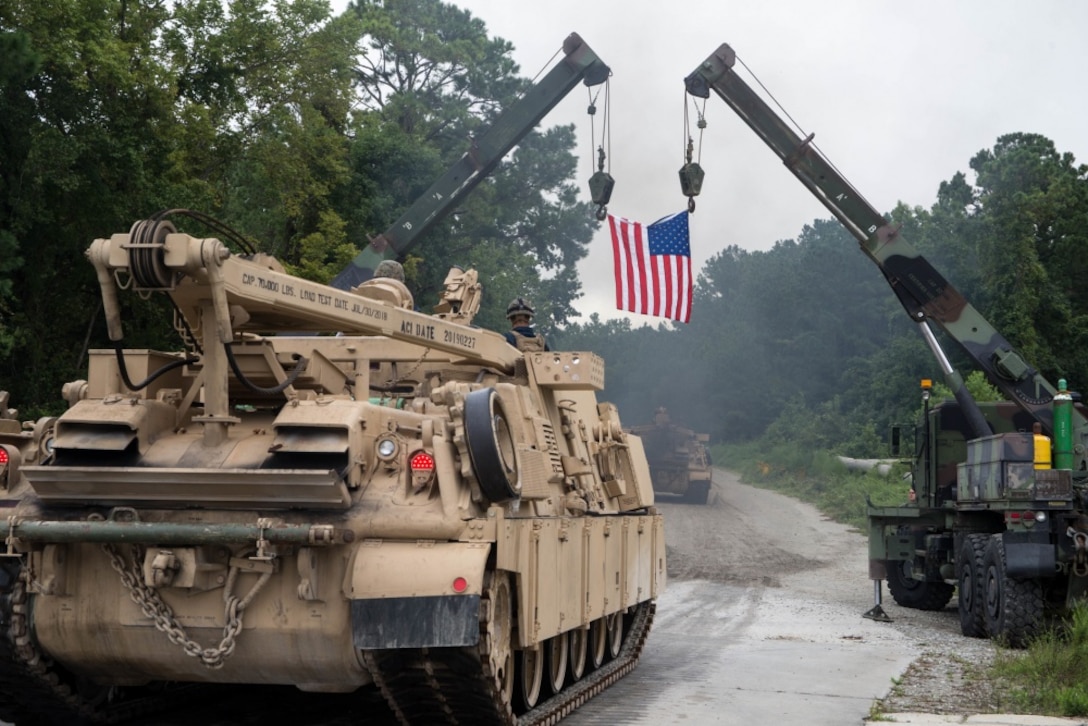 A U.S. Marine with 2d Tank Battalion, 2d Marine Division, drives one of the last commissioned Hercules M88 recovery vehicles off a maintenance lot on Camp Lejeune, North Carolina, August 17, 2020. As part of Force Design 2030, Hercules M88 recovery vehicles are being diverted from the Marine Corps in an effort to modernize and realign capabilities, units and personnel to higher priority areas. (U.S. Marine Corps photo by Cpl. Elijah J. Abernathy)