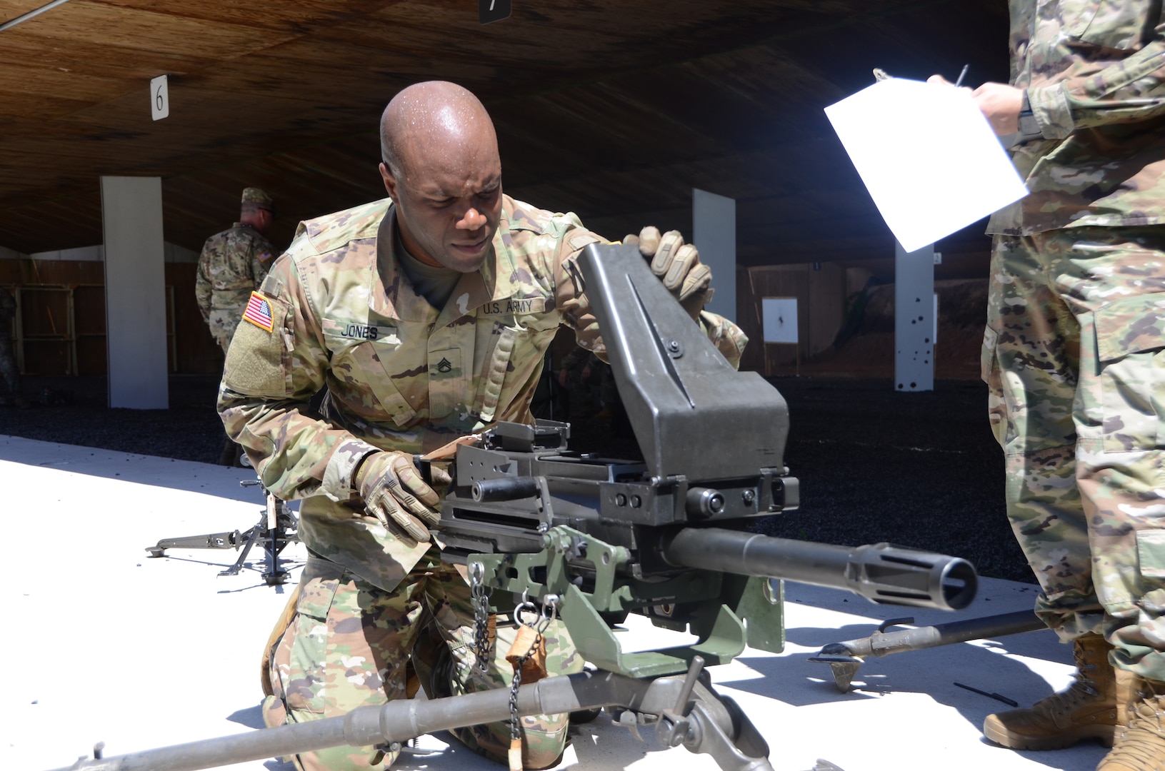 Staff Sgt. Eddie Jones, a Virginia National Guard Soldier assigned to the Fort Belvoir-based Headquarters Battalion, 29th Infantry Division, clears, assembles, disassembles and performs a function check on an MK 19 grenade launcher during Day 2 of the Region II Best Warrior Competition, July 29, 2020, at H Steven Blum Military Reservation in Glen Arm, Maryland. (U.S. National Guard photo by A.J. Coyne)