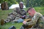 Staff Sgt. Eddie Jones, a Virginia National Guard Soldier assigned to the Fort Belvoir-based Headquarters Battalion, 29th Infantry Division, reacts to indirect fire during the Army Warrior Task portion of Day 1 of the Region II Best Warrior Competition, July 28, 2020, at H Steven Blum Military Reservation in Glen Arm, Maryland. (U.S. National Guard photo by A.J. Coyne)