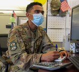 Senior Airman Sean Musrasrik, 21st Comptroller Squadron financial operations technician, completes work at his desk Aug. 18, 2020, at Schriever Air Force Base, Colorado. Musrasrik was one of six Airmen selected to speak during the first Financial Management Airmen’s Panel Aug. 12, 2020. (Air Force photo by Marcus Hill)